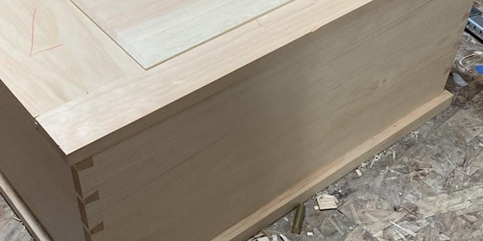 pale wooden chest sitting on top of plywood