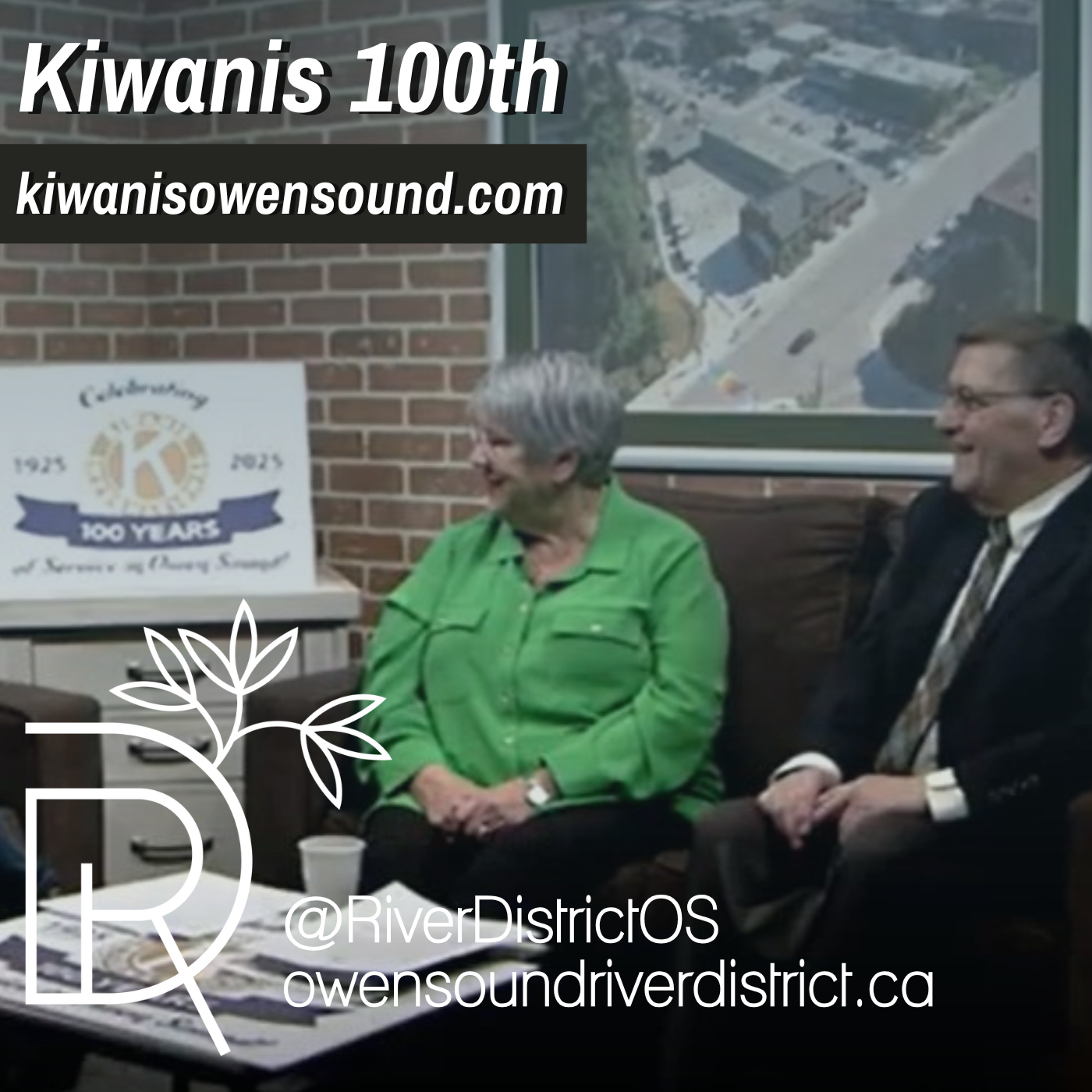 man and woman on brown couch in front of brick wall